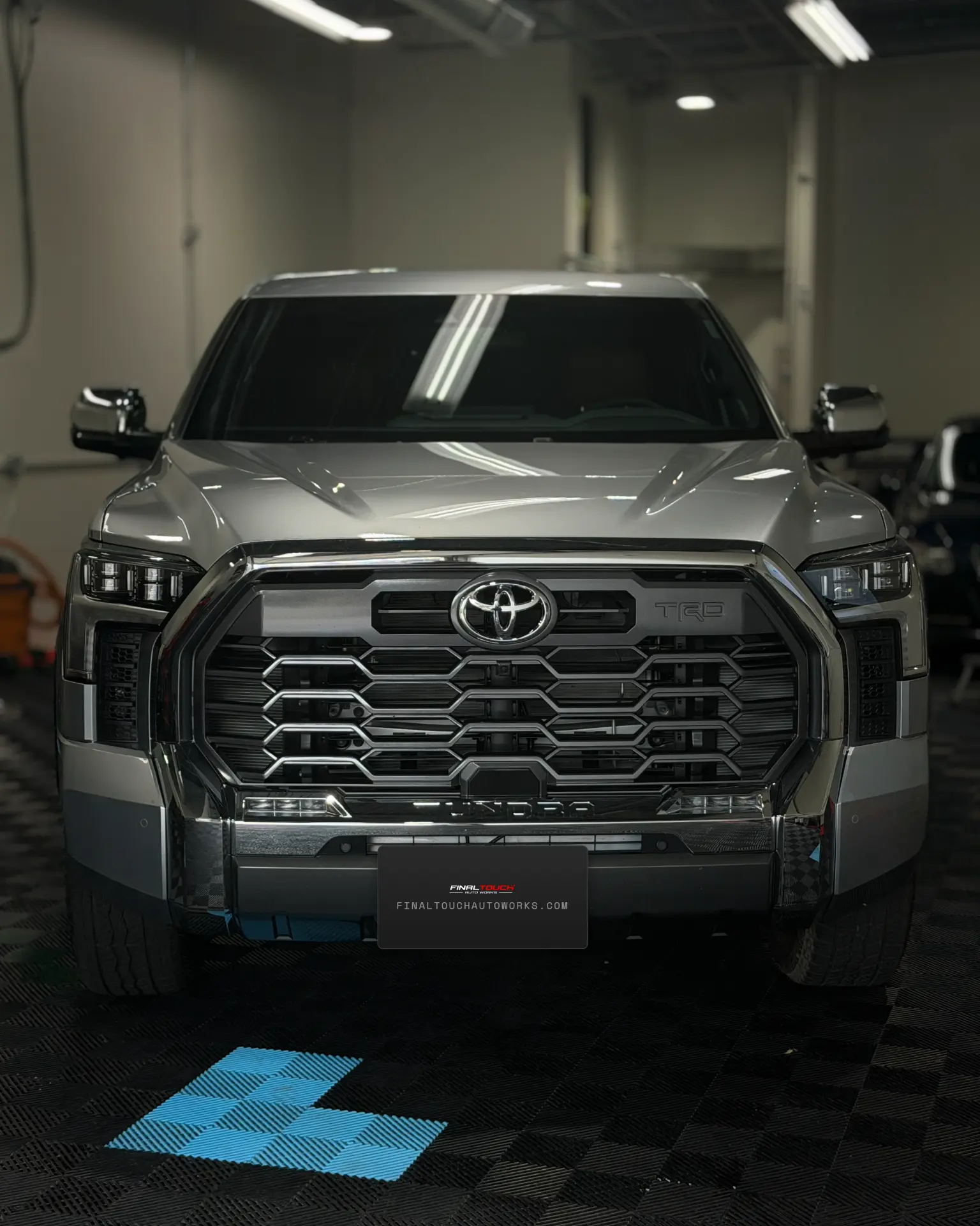 Silver Toyota Tundra TRD ceramic coated in the Final Touch Auto Works shop