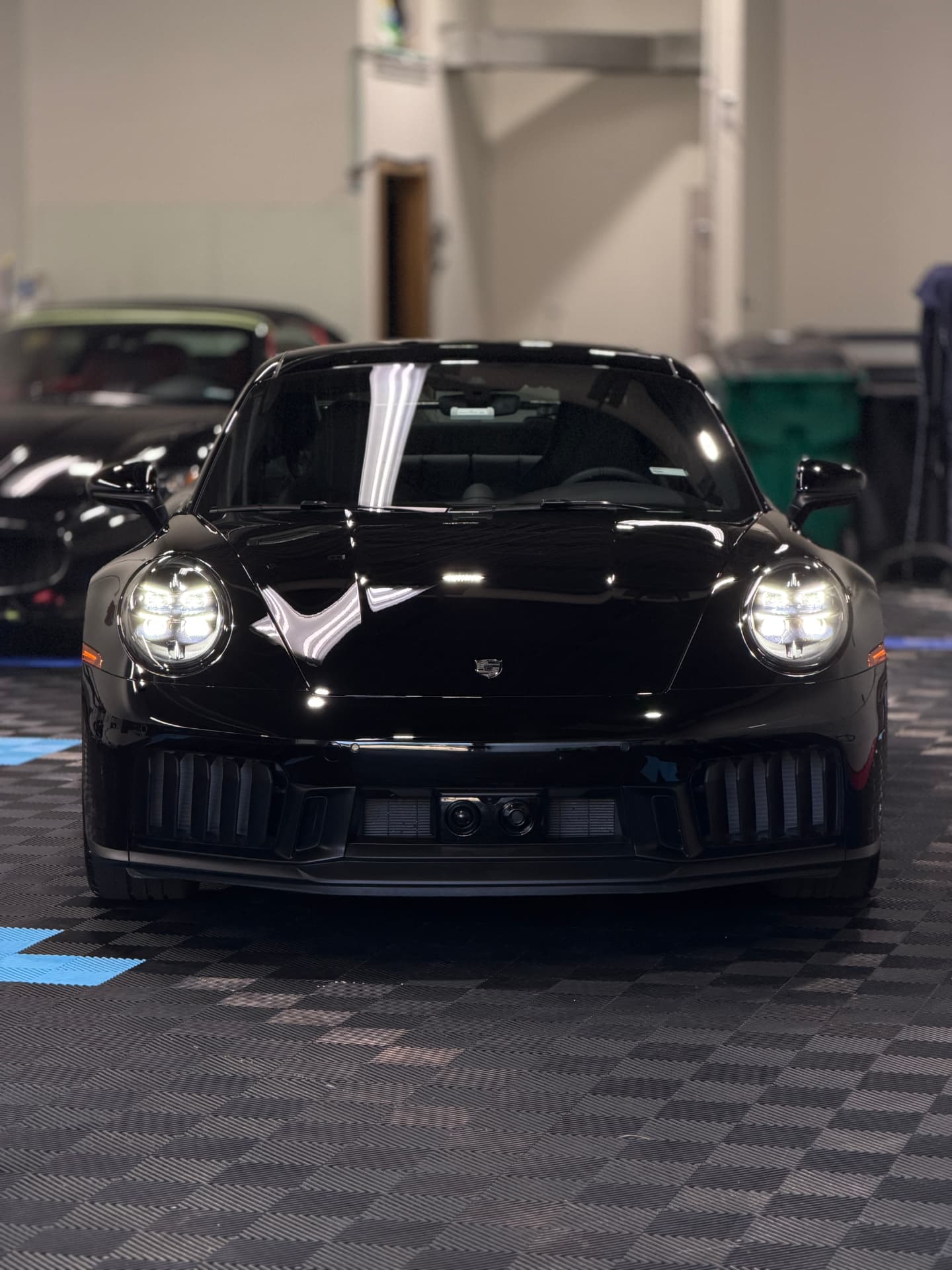 Black Porsche 911 with a mirror gloss finish after ceramic coating