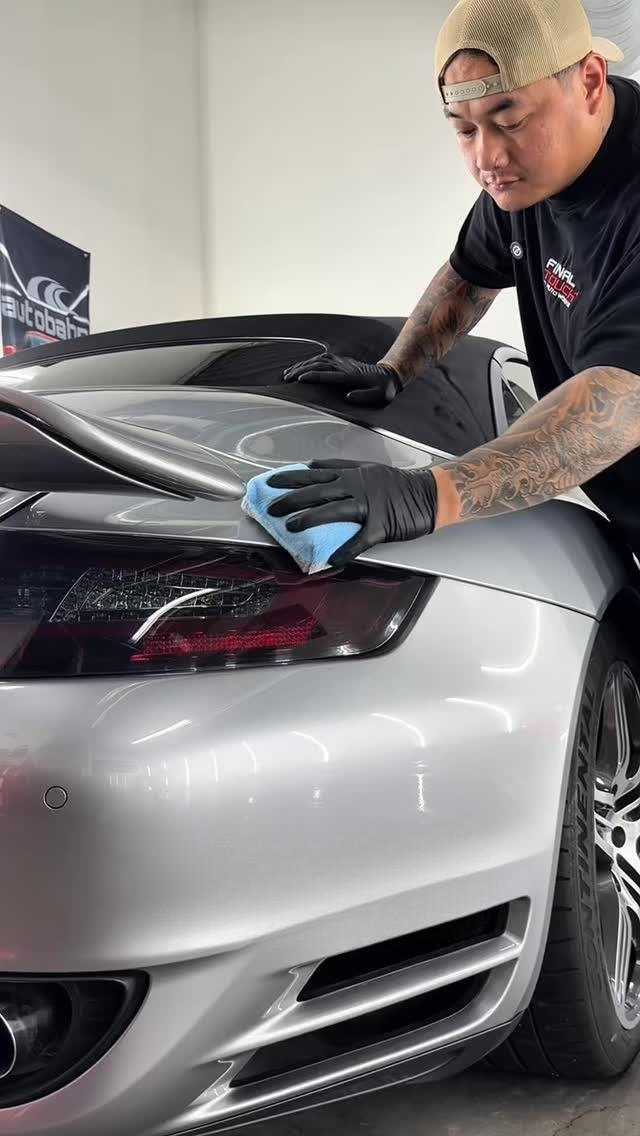 Final Touch Auto Works technician hand-polishing a Porsche 911 before ceramic coating